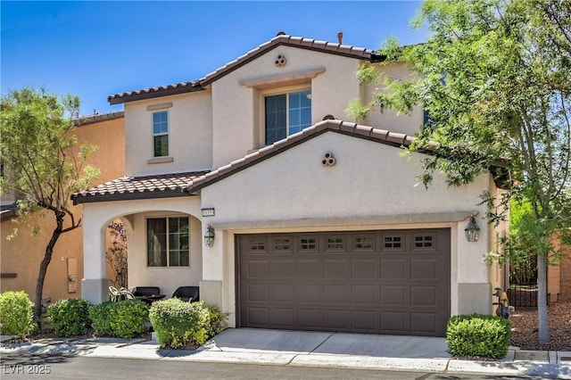 10353 Yew Blossom Ave, Las Vegas, NV 89166 - mediterranean / spanish house featuring a tiled roof, stucco siding, and concrete driveway