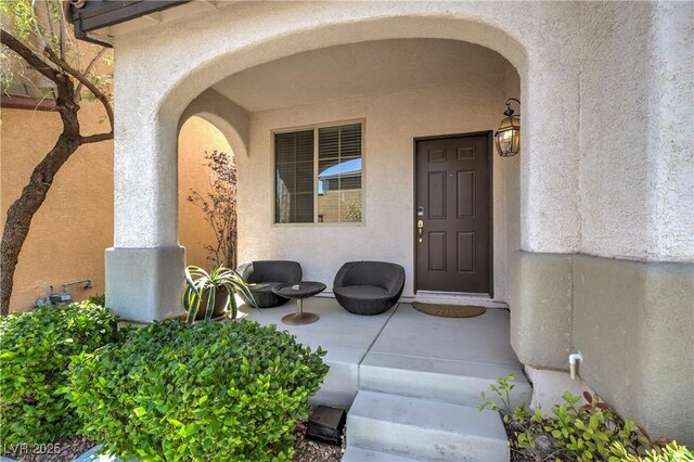 10353 Yew Blossom Ave, Las Vegas, NV 89166 - doorway to property featuring stucco siding
