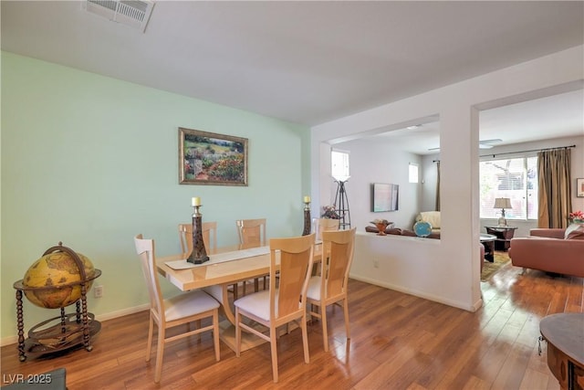 10353 Yew Blossom Ave, Las Vegas, NV 89166 - dining room with wood finished floors and baseboards