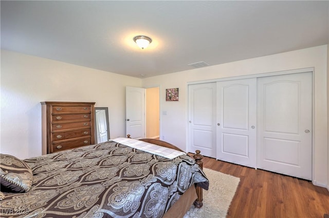 10353 Yew Blossom Ave, Las Vegas, NV 89166 - bedroom with wood finished floors and a closet