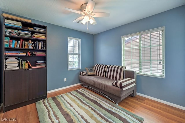 10353 Yew Blossom Ave, Las Vegas, NV 89166 - sitting room with a ceiling fan, wood finished floors, and baseboards