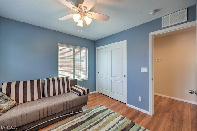 10353 Yew Blossom Ave, Las Vegas, NV 89166 - living area featuring wood finished floors, baseboards, and a ceiling fan