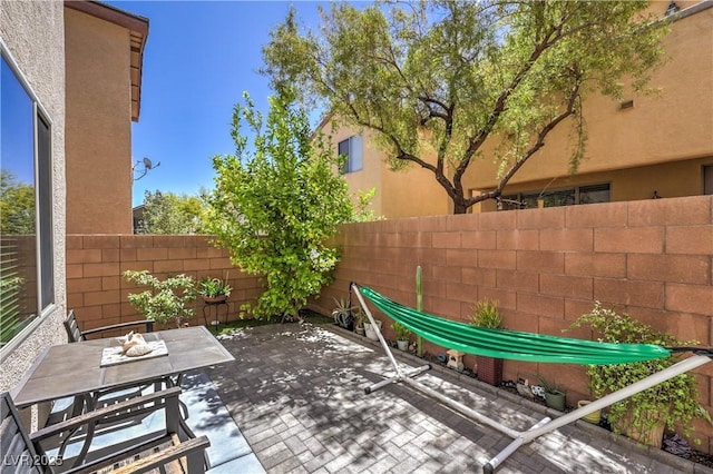 10353 Yew Blossom Ave, Las Vegas, NV 89166 - fenced backyard featuring a patio area and outdoor dining area