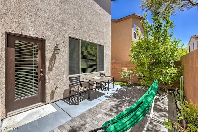 10353 Yew Blossom Ave, Las Vegas, NV 89166 - fenced backyard with a patio area