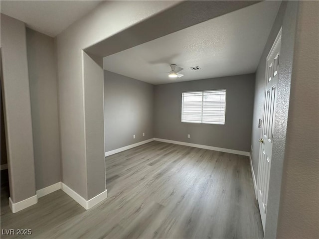 3340 Shallow Pond Dr, Las Vegas, NV 89117 - spare room featuring wood finished floors, ceiling fan, and baseboards