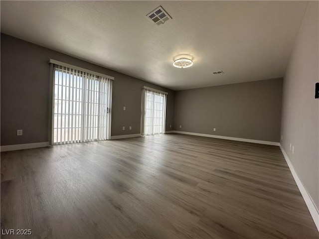 3340 Shallow Pond Dr, Las Vegas, NV 89117 - spare room with wood finished floors and baseboards