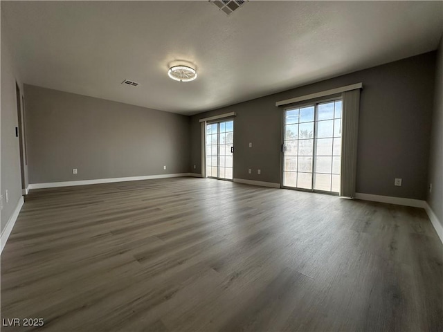 3340 Shallow Pond Dr, Las Vegas, NV 89117 - unfurnished room with wood finished floors and baseboards