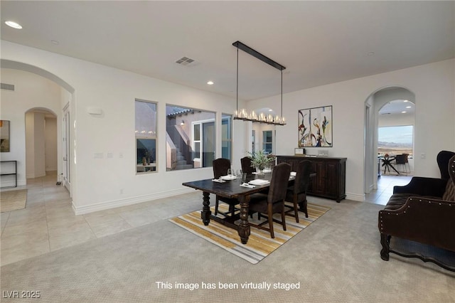 8 Laricola Ct, Henderson, NV 89011 - dining space featuring arched walkways, recessed lighting, light tile patterned floors, and baseboards