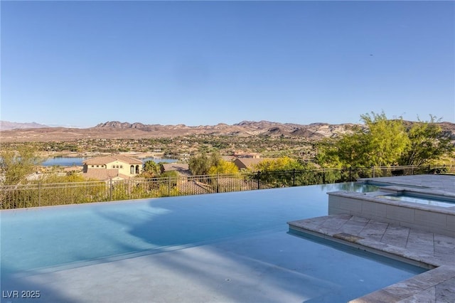 8 Laricola Ct, Henderson, NV 89011 - view of pool with a mountain view, a pool with connected hot tub, and a patio