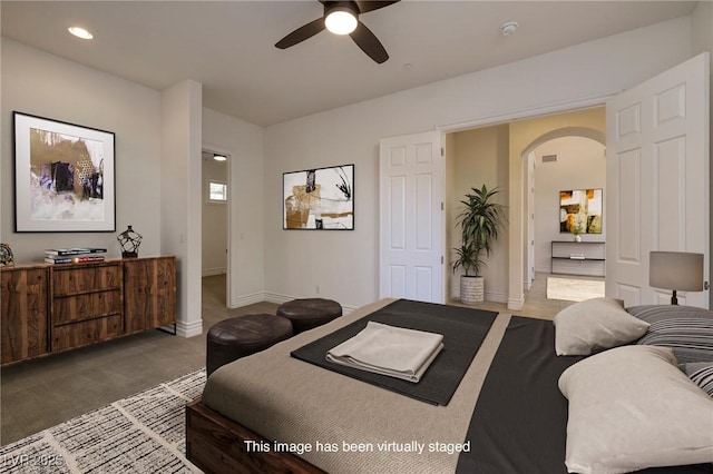 8 Laricola Ct, Henderson, NV 89011 - carpeted bedroom featuring arched walkways, baseboards, recessed lighting, and ceiling fan