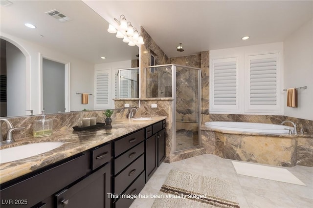 8 Laricola Ct, Henderson, NV 89011 - full bath featuring a garden tub, double vanity, a stall shower, and recessed lighting