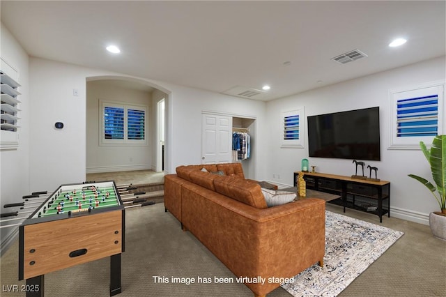 8 Laricola Ct, Henderson, NV 89011 - carpeted living room with arched walkways, recessed lighting, and baseboards