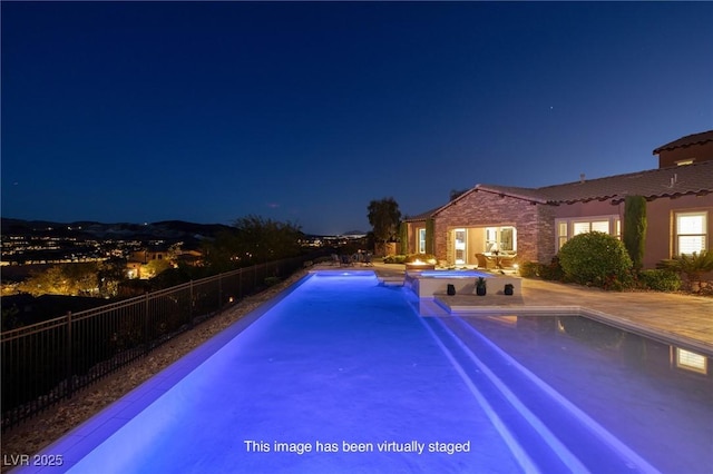8 Laricola Ct, Henderson, NV 89011 - pool at twilight featuring a patio area and a pool with connected hot tub