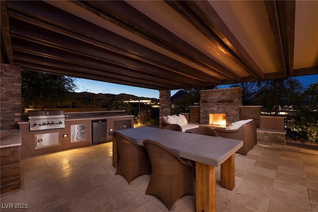 8 Laricola Ct, Henderson, NV 89011 - view of patio / terrace with an outdoor stone fireplace