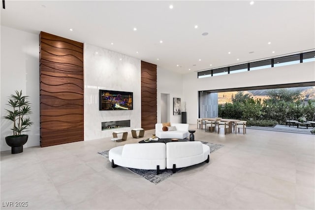 6 Rockmount Ct, Henderson, NV 89012 - living area with a high ceiling, a fireplace, and recessed lighting