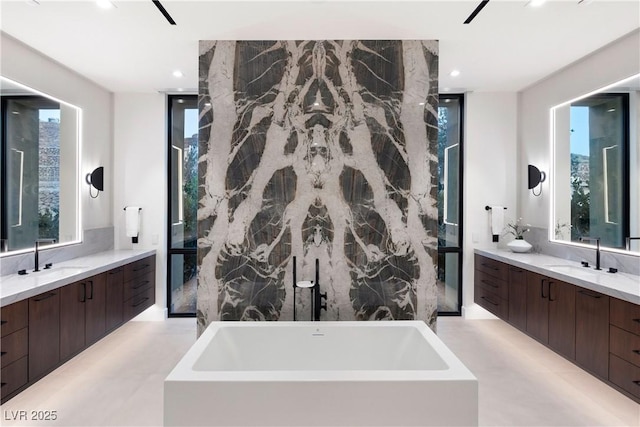 6 Rockmount Ct, Henderson, NV 89012 - bathroom featuring a soaking tub, two vanities, and recessed lighting