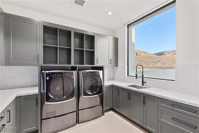 6 Rockmount Ct, Henderson, NV 89012 - laundry area featuring cabinet space, separate washer and dryer, recessed lighting, and a mountain view