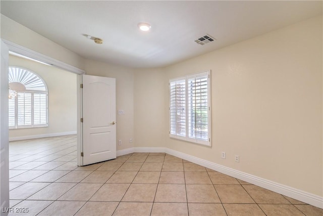 1044 Spanish Needle St, Henderson, NV 89002 - empty room featuring light tile patterned flooring, baseboards, and a smoke detector