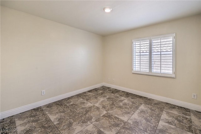 1044 Spanish Needle St, Henderson, NV 89002 - empty room with baseboards and stone finish floors