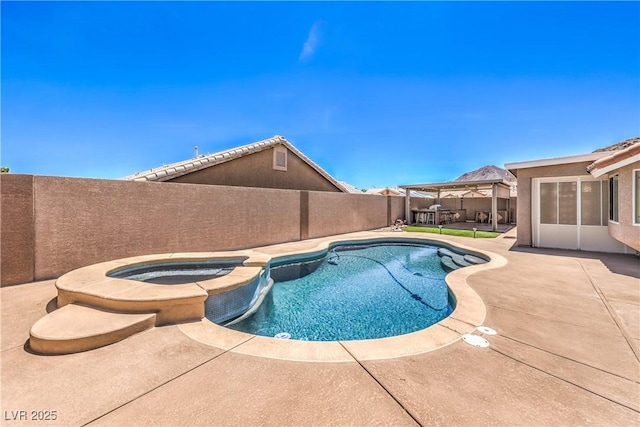 1044 Spanish Needle St, Henderson, NV 89002 - view of swimming pool featuring a fenced backyard, a pool with connected hot tub, and a patio