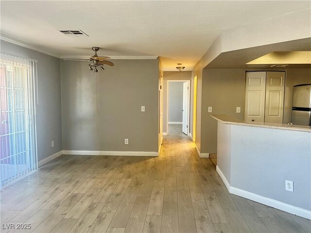 8600 W Charleston Blvd Unit 2033, Las Vegas, NV 89117 - spare room with a ceiling fan, light wood-style flooring, ornamental molding, and baseboards
