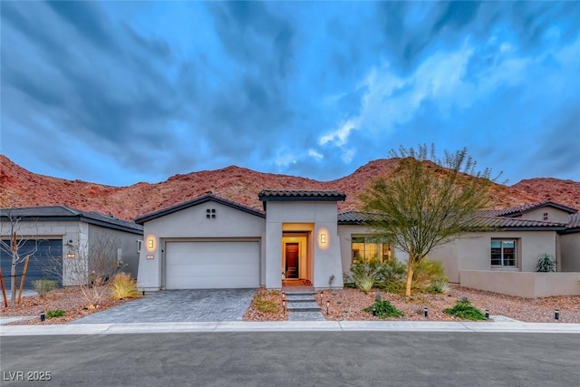 101 Mirage View Dr, Henderson, NV 89011 - view of front of property with stucco siding, a garage, and a tiled roof