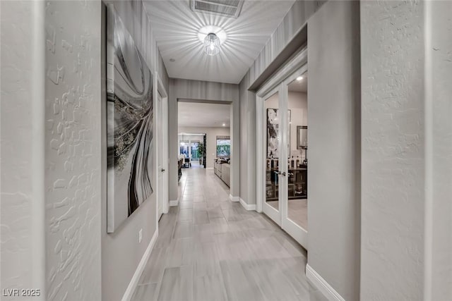 101 Mirage View Dr, Henderson, NV 89011 - hallway featuring french doors and baseboards