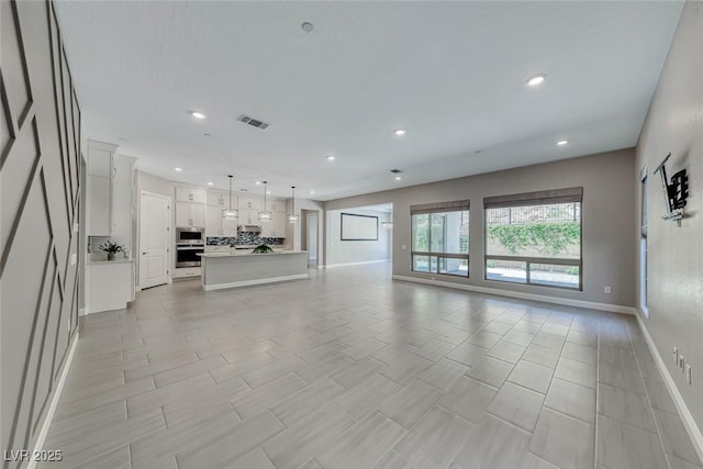 101 Mirage View Dr, Henderson, NV 89011 - unfurnished living room with recessed lighting and baseboards