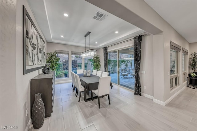 101 Mirage View Dr, Henderson, NV 89011 - dining area with healthy amount of natural light, baseboards, recessed lighting, and a tray ceiling
