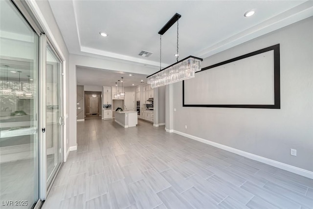 101 Mirage View Dr, Henderson, NV 89011 - unfurnished living room with baseboards, recessed lighting, and a chandelier