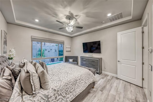 101 Mirage View Dr, Henderson, NV 89011 - bedroom with a tray ceiling, light wood-style floors, baseboards, a ceiling fan, and recessed lighting