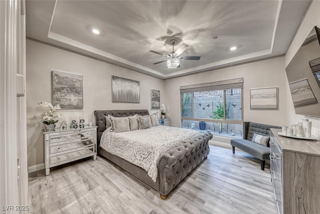 101 Mirage View Dr, Henderson, NV 89011 - bedroom with a tray ceiling, baseboards, light wood finished floors, and recessed lighting