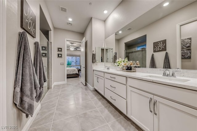 101 Mirage View Dr, Henderson, NV 89011 - ensuite bathroom featuring double vanity, a ceiling fan, tile patterned flooring, recessed lighting, and baseboards