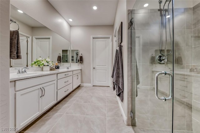 101 Mirage View Dr, Henderson, NV 89011 - full bathroom featuring double vanity, a shower stall, tile patterned floors, recessed lighting, and baseboards