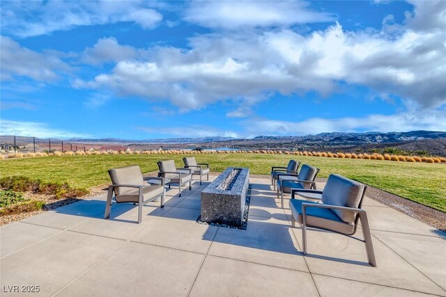 101 Mirage View Dr, Henderson, NV 89011 - view of patio / terrace featuring a mountain view and an outdoor living space with a fire pit