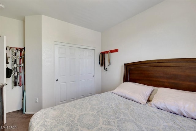 2117 Leatherbridge Ct, North Las Vegas, NV 89081 - bedroom with dark carpet, a closet, and baseboards