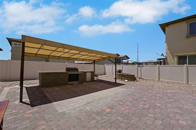 2117 Leatherbridge Ct, North Las Vegas, NV 89081 - fenced backyard with exterior kitchen and a patio area