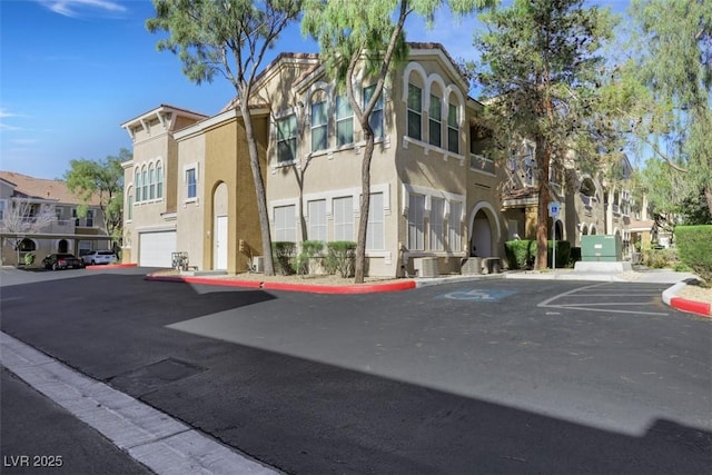 10001 Peace Way Unit 1250, Las Vegas, NV 89147 - view of building exterior with a residential view and uncovered parking