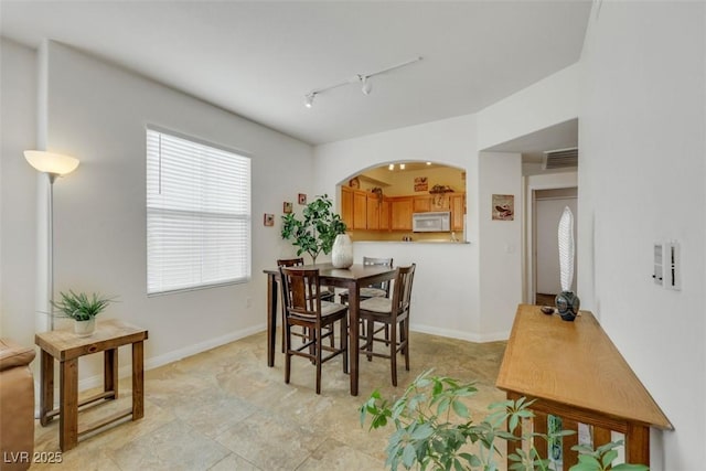 10001 Peace Way Unit 1250, Las Vegas, NV 89147 - dining room featuring track lighting and arched walkways