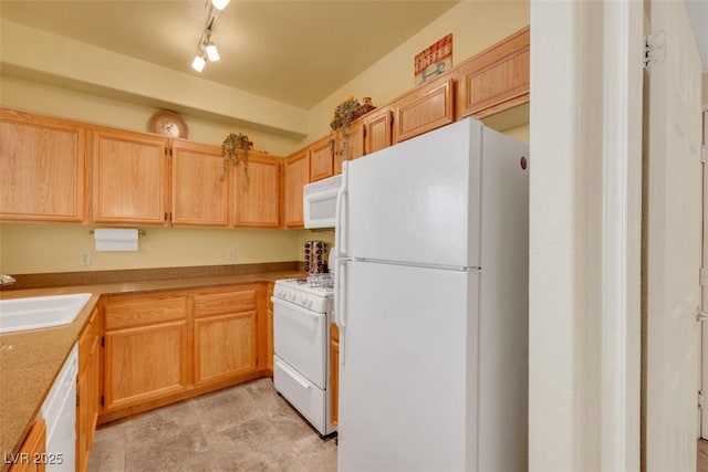 10001 Peace Way Unit 1250, Las Vegas, NV 89147 - kitchen featuring white appliances, a sink, and light brown cabinetry