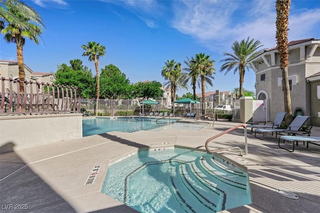 10001 Peace Way Unit 1250, Las Vegas, NV 89147 - community pool featuring a hot tub, a patio area, and a residential view