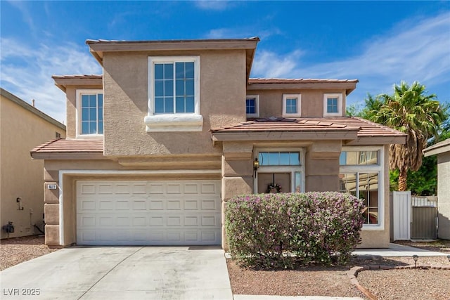4622 English Lavender Ave, North Las Vegas, NV 89031 - view of front of house with a garage, driveway, stucco siding, and a tiled roof