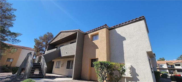 3151 Soaring Gulls Dr Unit 2058, Las Vegas, NV 89128 - view of building exterior featuring stairs