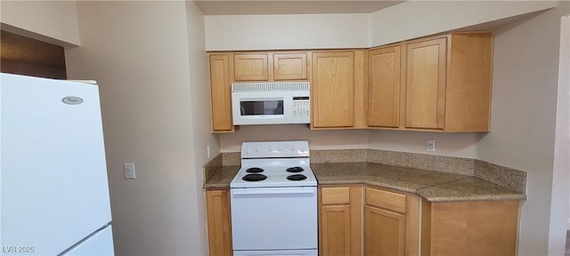 3151 Soaring Gulls Dr Unit 2058, Las Vegas, NV 89128 - kitchen with white appliances and light brown cabinetry