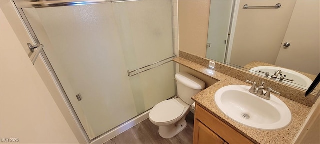 3151 Soaring Gulls Dr Unit 2058, Las Vegas, NV 89128 - bathroom with a stall shower, toilet, vanity, and wood finished floors