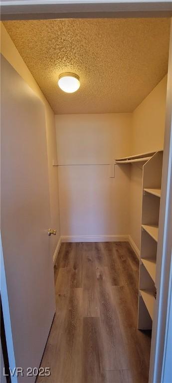 3151 Soaring Gulls Dr Unit 2058, Las Vegas, NV 89128 - spacious closet featuring wood finished floors