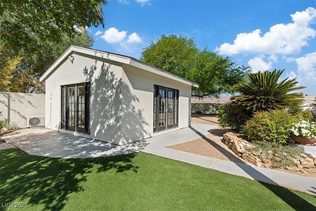 204 Canyon Dr, Las Vegas, NV 89107 - view of outdoor structure with a cooling unit and french doors