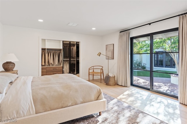 204 Canyon Dr, Las Vegas, NV 89107 - bedroom with access to outside, wood finished floors, recessed lighting, and a closet