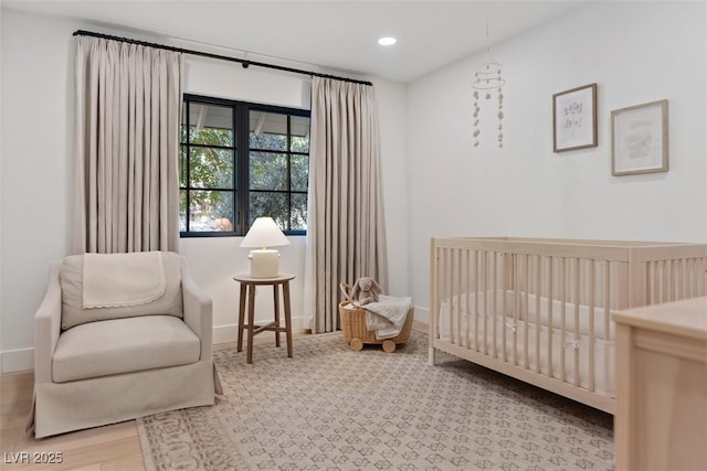 204 Canyon Dr, Las Vegas, NV 89107 - bedroom featuring a crib, baseboards, and recessed lighting