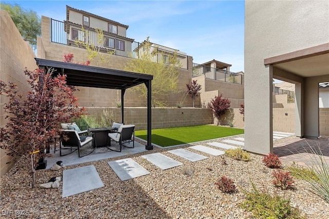 2367 Ridgeline Wash St, Las Vegas, NV 89138 - fenced backyard with a patio area and a fire pit